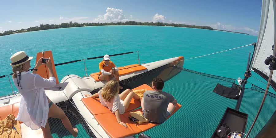 Bora Bora: Sunset Catamaran Cruise with Snacks and Drinks - Champagne, snacks, and the limits of the drinks service