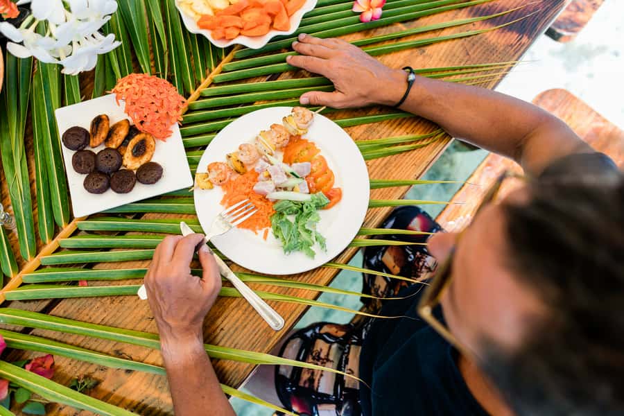 Private Bora Bora Lagoon Snorkel Cruise with BBQ Picnic - Meeting rays in shallow lagoon water